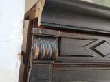 a close up of a door handle on a black cabinet