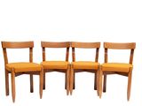 three wooden chairs with a yellow seat and back cushion