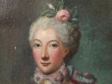 portrait of a lady in a pink dress with a flower in her hair