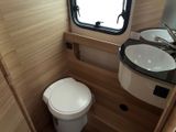 a small bathroom with a toilet and a sink in it