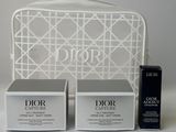 two boxes of dior beauty products sitting on a white table