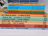 several books stacked on top of each other on a table