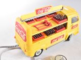 a yellow toy bus with a bunch of bottles in it