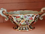a bowl with a floral design on it on a table