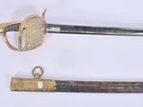 two different types of swords on display on a table