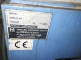 a sign on the side of a machine that is blue and white