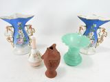 three vases that are sitting next to each other on a table