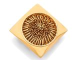 an image of a gold plate with a flower design on it