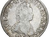 une pièce d'argent portant une tête de femme et une couronne