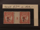 deux timbres représentant un bâtiment sur fond noir
