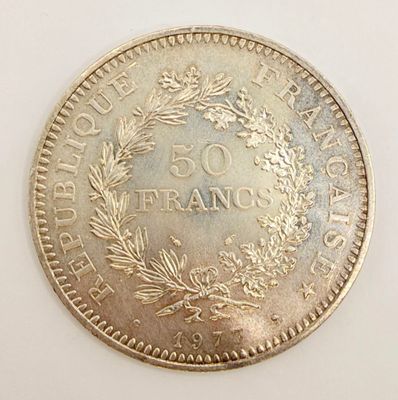 a close up of a coin on a table with a white background