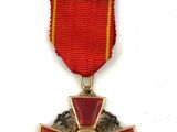 an image of a red and gold medal with a red ribbon around it
