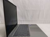 an open laptop computer sitting on top of a white table