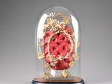 a glass dome with a clock inside of it