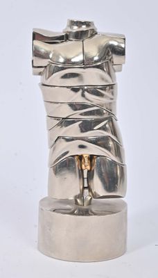 a silver sculpture of a torso on a pedestal