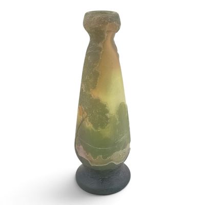 a vase that is sitting on a stand on a white surface