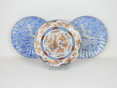 two plates with blue and orange designs on them