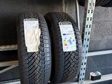 two tires that are on a shelf in the garage