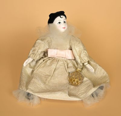 an image of a doll sitting on top of a table