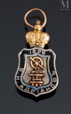 an image of a metal badge with a crown on top of it