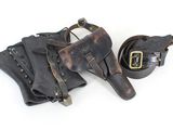 pair of leather holsters and belt on a white background