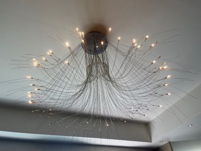 a large chandelier hanging from the ceiling in a room