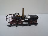 a model of a steam engine on a train track