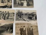 several old black and white photos of people and animals on a table