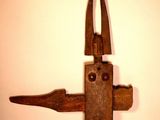 a small wooden object that looks like a bird