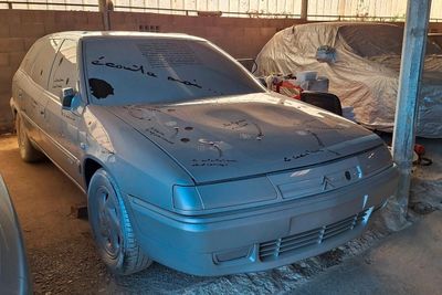 a silver car that is parked in a garage
