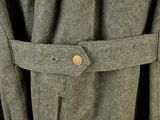 a close up of a coat with a button on it