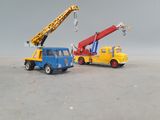 two toy trucks that are sitting next to each other