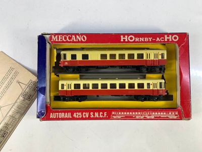 a box with three train cars in it on a table