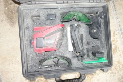 a case with tools in it sitting on the floor