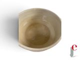 a white bowl with a brown rim on a white surface