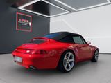 the red sports car is parked in the garage of a building