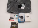 the contents of a computer bag are laid out on the table