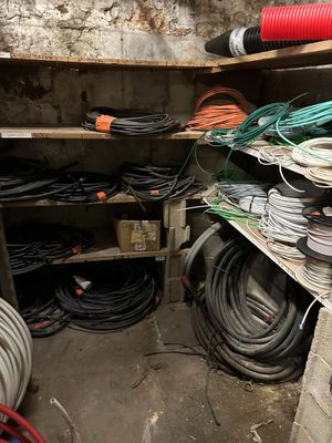 many wires and hoses on the shelves in the room