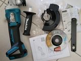 a cordless drill and other tools sitting on a tile floor