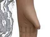 a close up of a doll ' s hand with a lace overlay