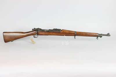 a rifle with a wooden barrel on a white background
