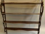 a wooden shelf with three shelves on each side and two shelves on the other side