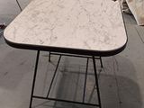 a table that is sitting on the floor in a room