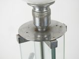 a light that is sitting on top of a glass stand