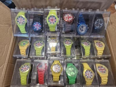 a box with many different colored watches in it