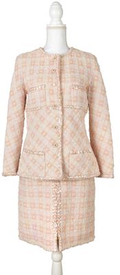 pink tweed jacket and skirt suit on a mannequin mannequin mannequin mannequin mannequin mannequin mannequin mannequin