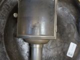 a metal object in a metal container on a table
