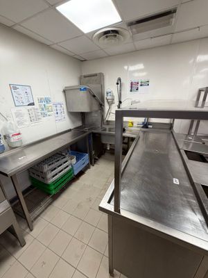 an image of a commercial kitchen with stainless steel counter tops