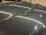 a close up of a car ' s hood with a sticker on it