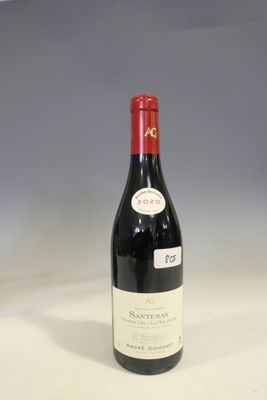 a bottle of wine that is sitting on a table